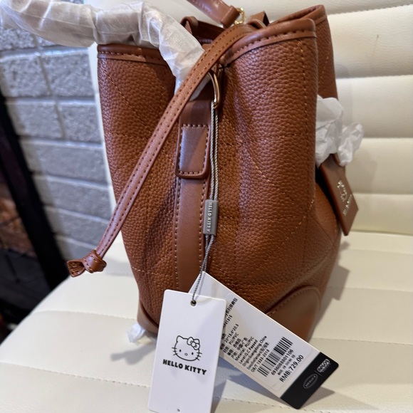 -Not- Coach Tan Leather Hello Kitty Crossbody - Picture 4 of 12
